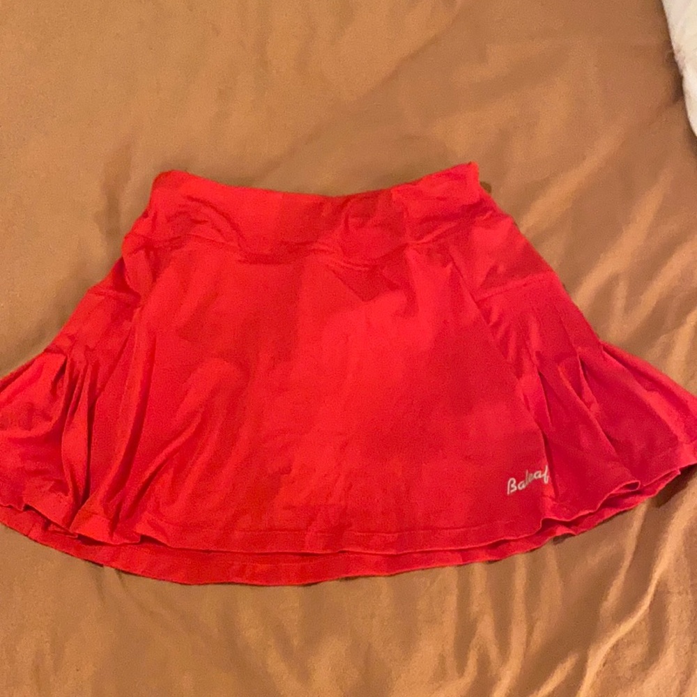 Red tennis skirt